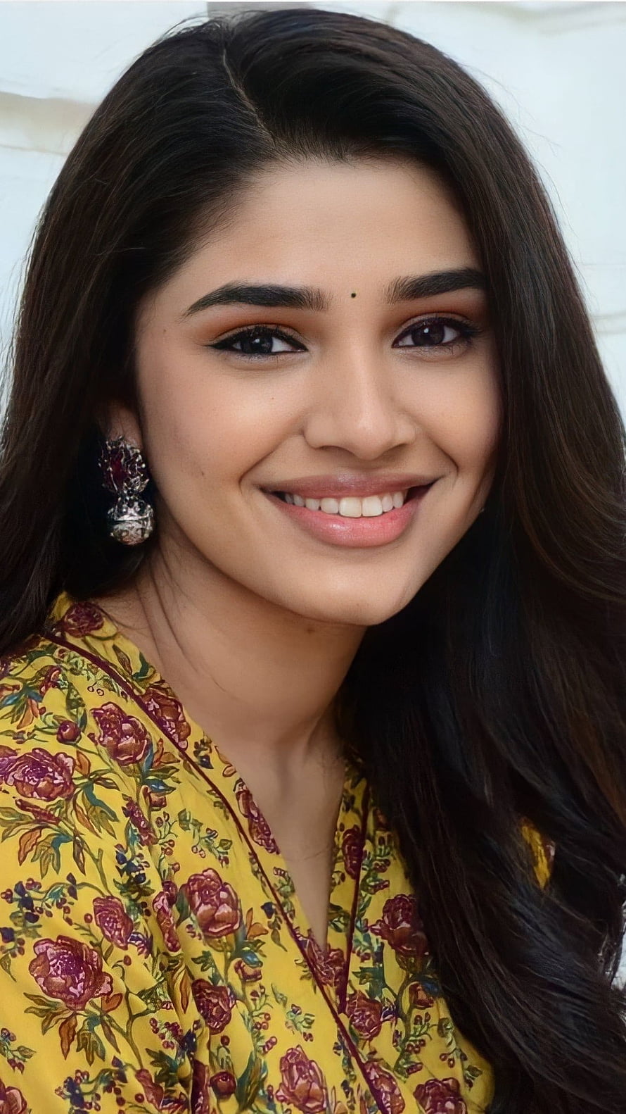 Krithi Shetty Portrait in Yellow Floral Kurta with Traditional Earrings HD phone wallpaper