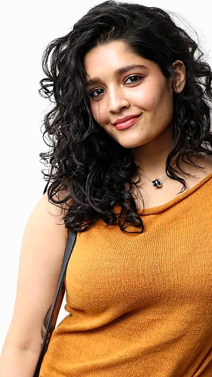 Rithika Singh Portrait in Mustard Top with Curly Hair HD phone wallpaper