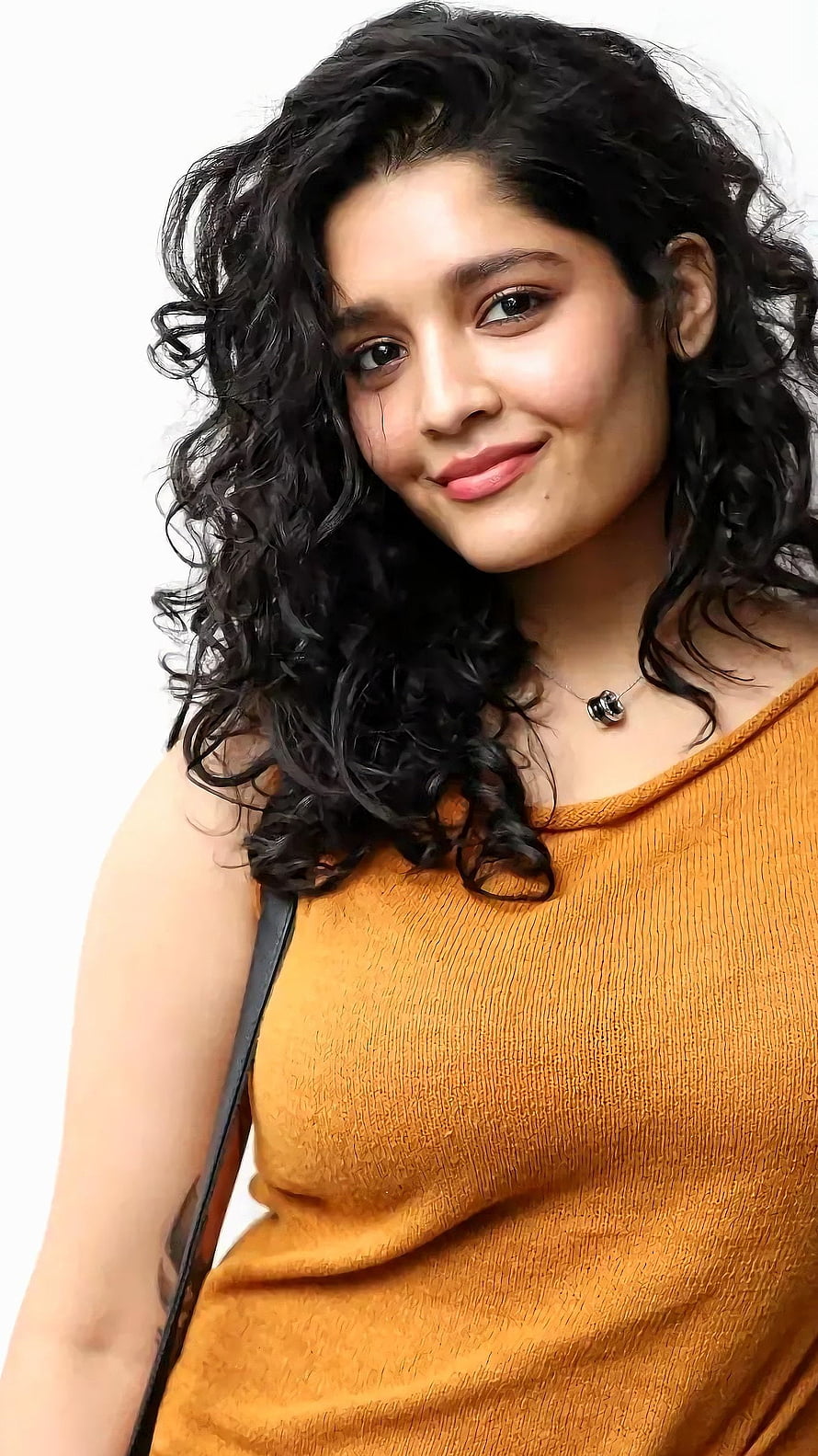 Rithika Singh Portrait in Mustard Top with Curly Hair HD phone wallpaper