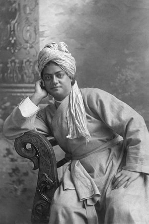 Swami Vivekananda in Traditional Turban and Robe Seated in Ornate Chair HD phone wallpaper