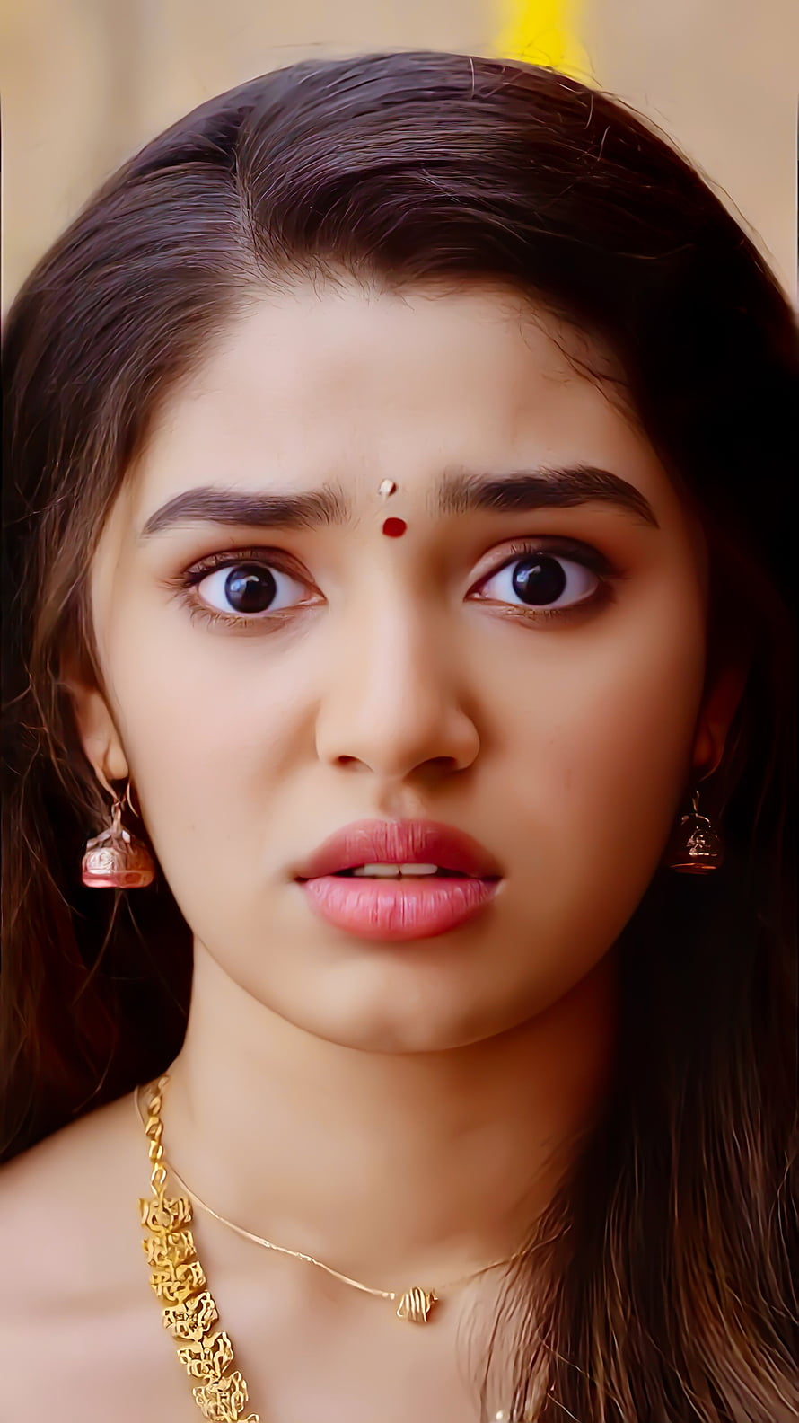 Krithi Shetty Close-Up Portrait Wearing Traditional Gold Jewelry and Bindis HD phone wallpaper