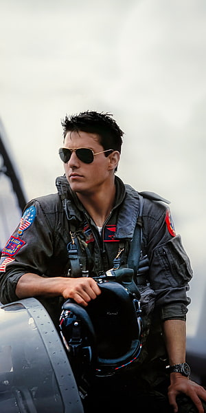 Tom Cruise as Maverick in Top Gun Flight Suit and Aviator Sunglasses HD phone wallpaper