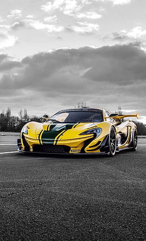 Yellow and Green McLaren P1 GTR Track Car on Asphalt Under Dramatic Clouds HD phone wallpaper