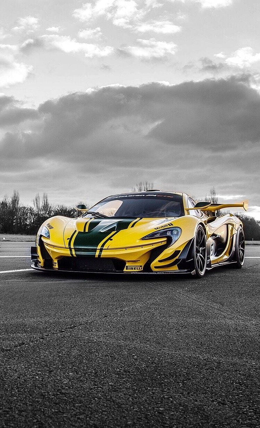 Yellow and Green McLaren P1 GTR Track Car on Asphalt Under Dramatic Clouds HD phone wallpaper