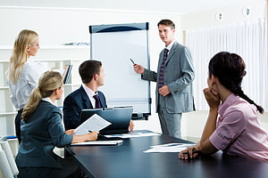 Corporate Team Meeting in Modern Office with Whiteboard Presentation HD wallpaper