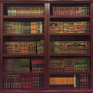 Traditional Islamic Library Bookshelf with Arabic Calligraphy and Classic Volumes HD phone wallpaper