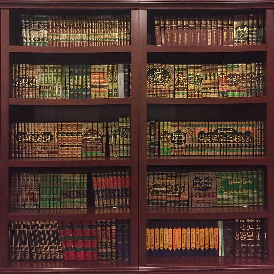 Traditional Islamic Library Bookshelf with Arabic Calligraphy and Classic Volumes HD phone wallpaper