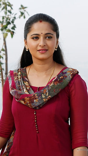 Anushka Shetty in a Maroon Kurta with Floral Dupatta and Gold Jewelry HD phone wallpaper