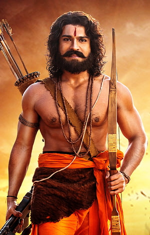Ram Charan as Rana in RRR with bow and arrows in traditional warrior attire HD phone wallpaper