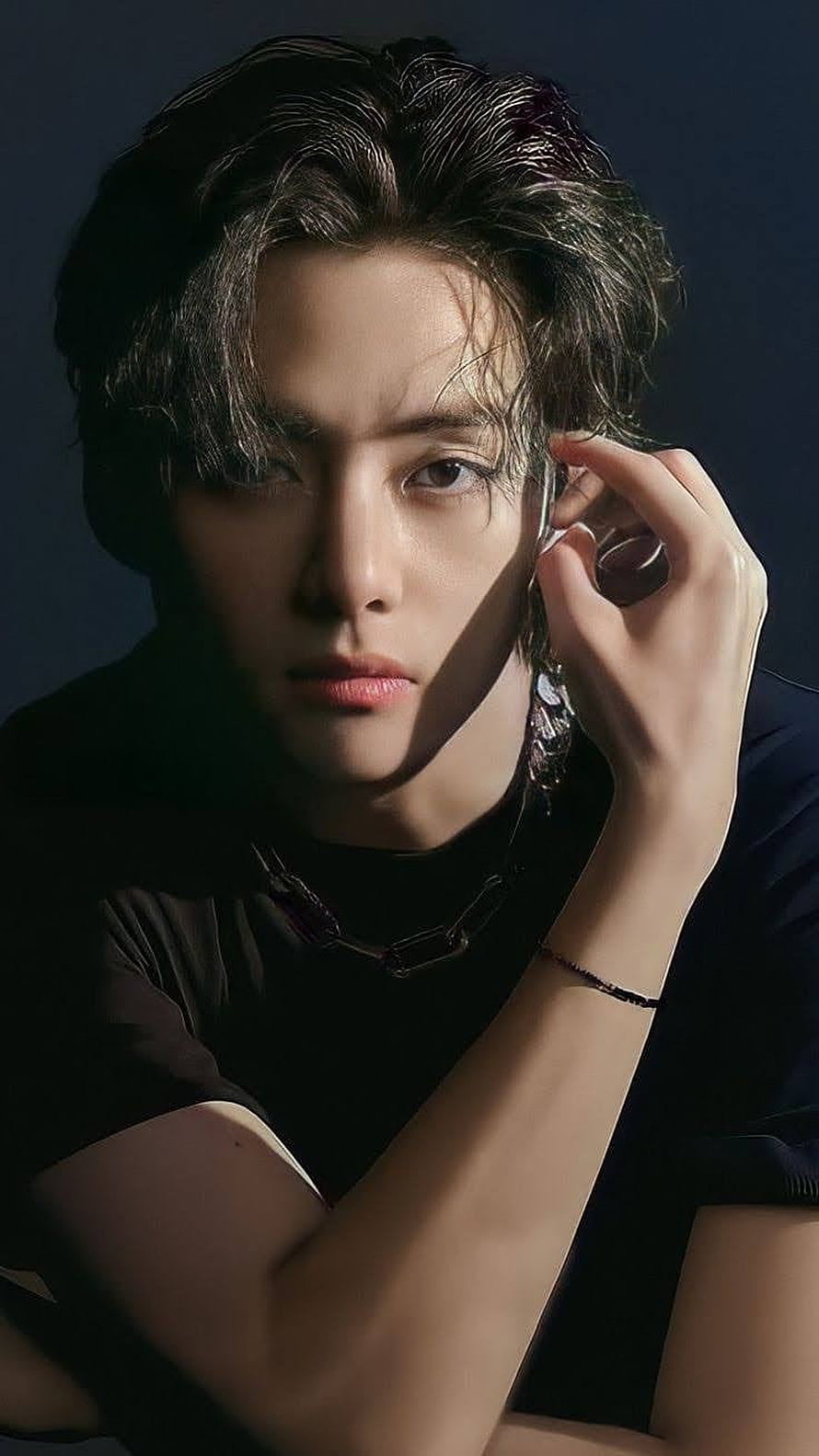 V from BTS in moody studio portrait with dramatic lighting and dark styling HD phone wallpaper