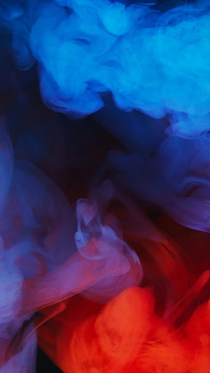 Vibrant Blue and Red Smoke Swirling in Dark Abstract Composition HD phone wallpaper