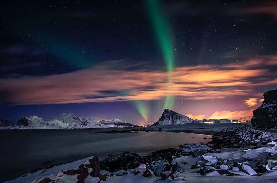 Green Aurora Borealis Dancing Over Snowy Mountains and a Calm Lake at Night HD wallpaper