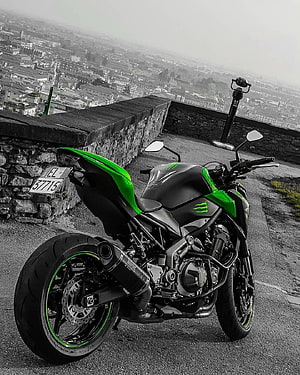 Kawasaki Ninja Z900 Motorcycle Parked on Hilltop with City View HD phone wallpaper