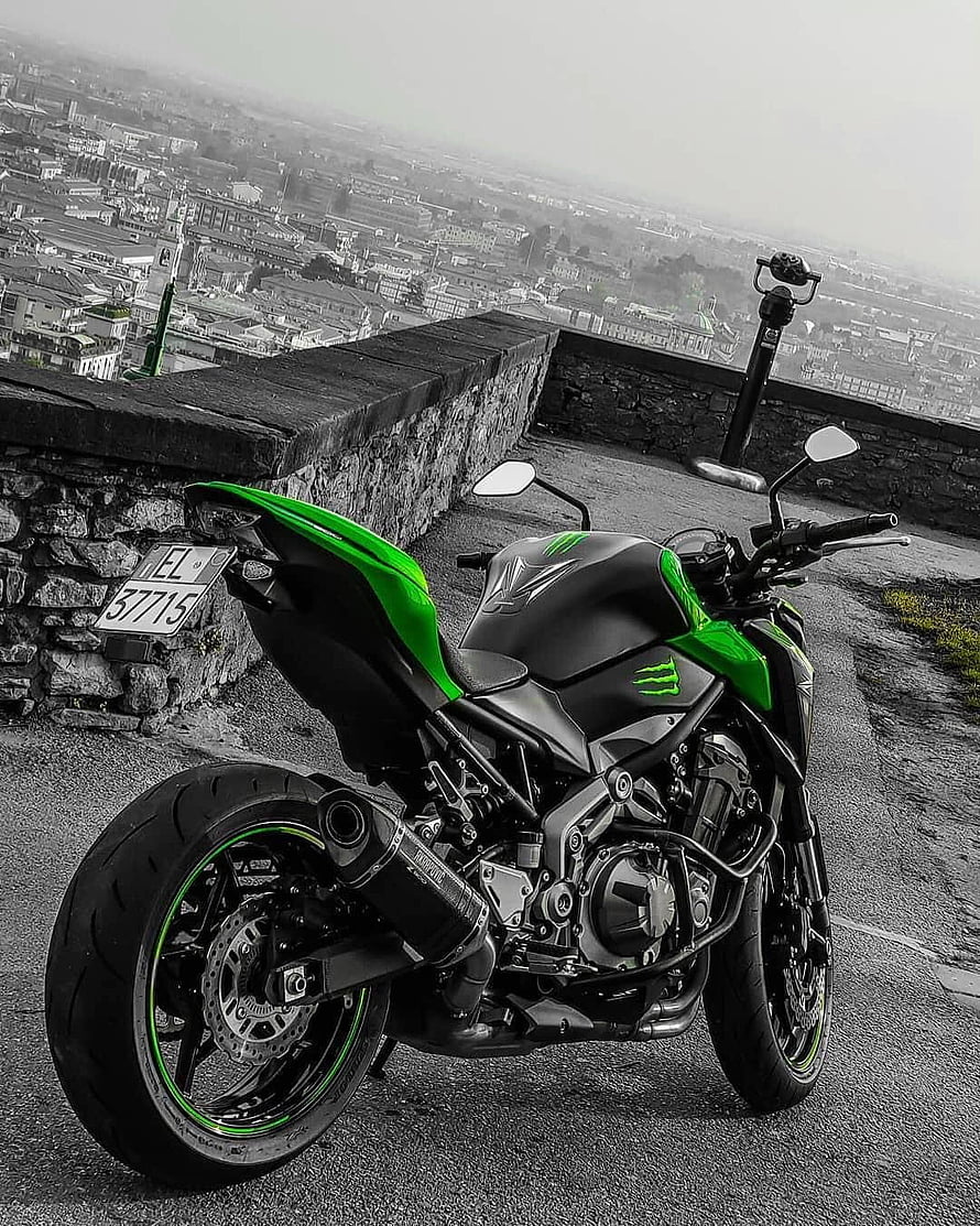 Kawasaki Ninja Z900 Motorcycle Parked on Hilltop with City View HD phone wallpaper