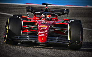 Scuderia Ferrari F1-75 Formula 1 car on the race track HD wallpaper
