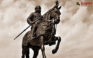 Bronze Statue of Maharana Pratap on Horseback with Lance Against Dramatic Sky HD wallpaper