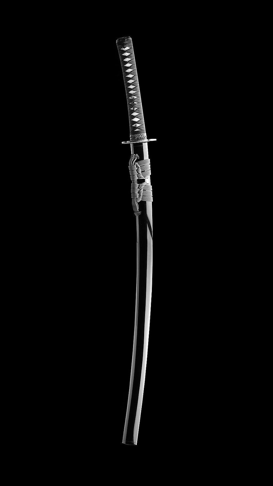 Traditional Japanese Katana Sword with Ornate Hilt and Polished Blade on Black Background HD phone wallpaper
