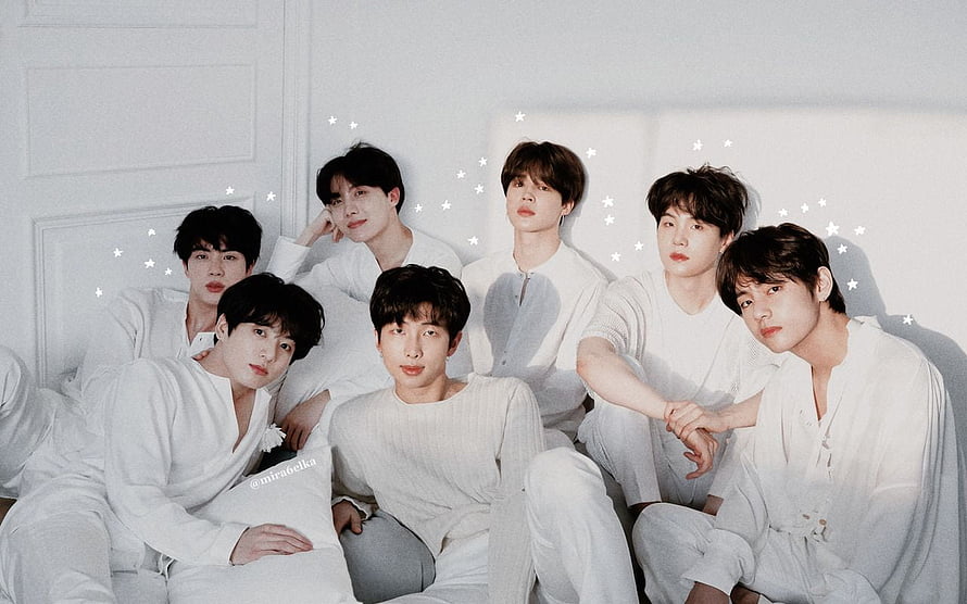 BTS Members in White Outfits Group Portrait with Star Accents HD wallpaper