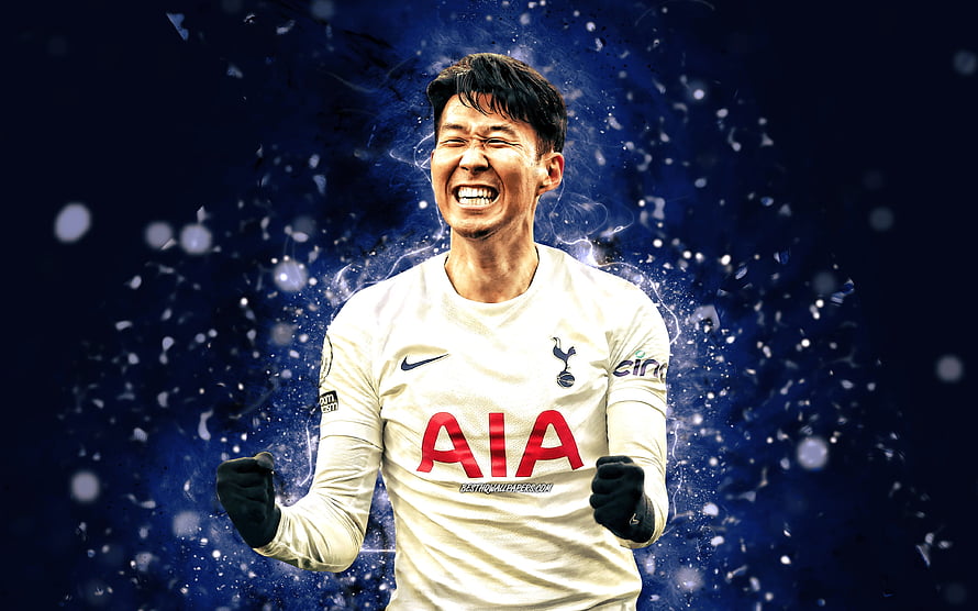 Son Heung-min Celebrating in Tottenham Hotspur White Away Kit with Dynamic Blue Background HD wallpaper