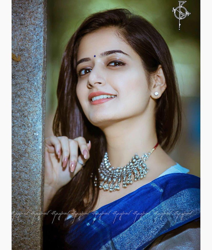 Ashika Ranganath in a blue saree with ornate silver necklace and bindi HD phone wallpaper