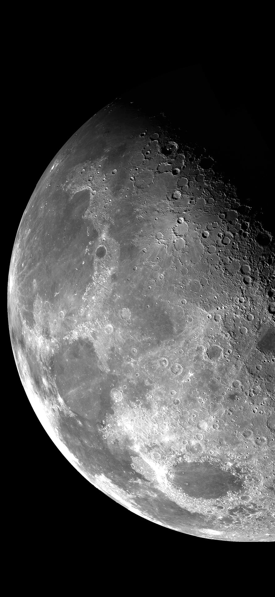 Detailed Close-Up of the Moon Surface with Craters and Lunar Terrain in Black and White HD phone wallpaper