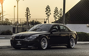 Black BMW M5 E60 Sedan Parked on Asphalt at Golden Hour Sunset HD wallpaper