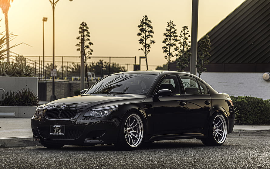 Black BMW M5 E60 Sedan Parked on Asphalt at Golden Hour Sunset HD wallpaper