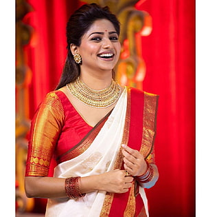 Rachita Ram in a red and white silk saree with traditional gold jewelry HD phone wallpaper