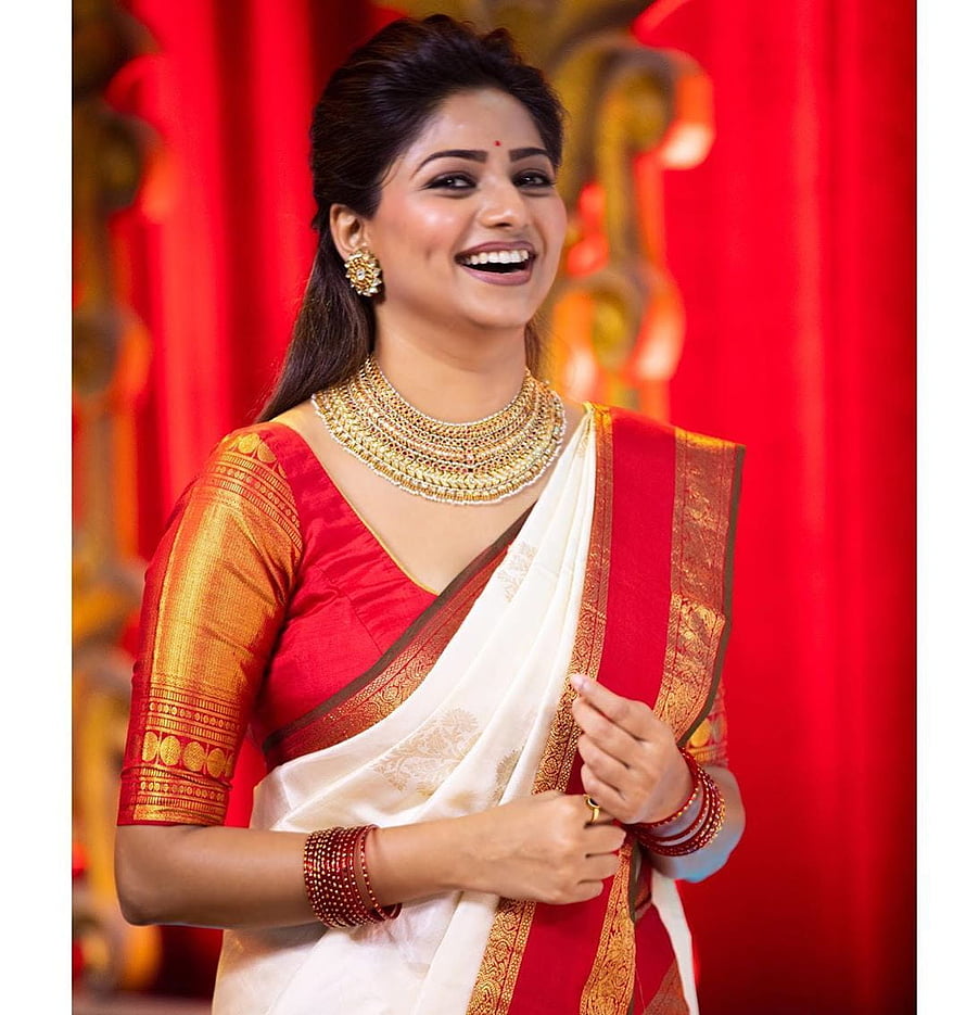 Rachita Ram in a red and white silk saree with traditional gold jewelry HD phone wallpaper