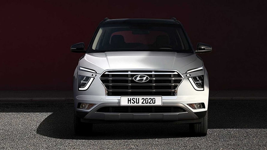 Front View of a Silver Hyundai Creta SUV Parked Against a Dark Maroon Wall HD wallpaper