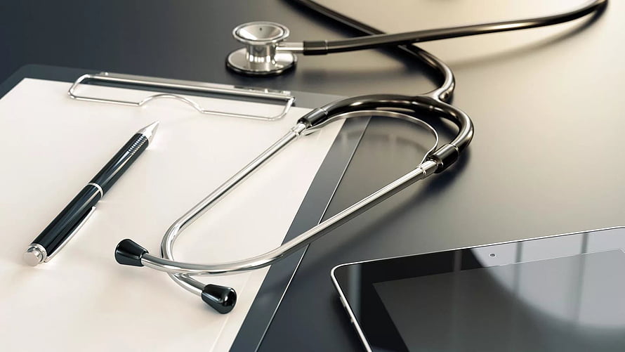 Stethoscope, clipboard, and pen on a desk with a tablet for medical professionals HD wallpaper