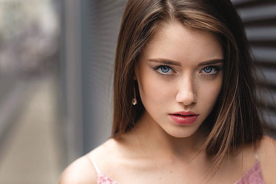 Close-up portrait of a young woman with striking blue eyes and long brown hair, Unknown Model, gorgeous, model, beautiful, woman HD wallpaper