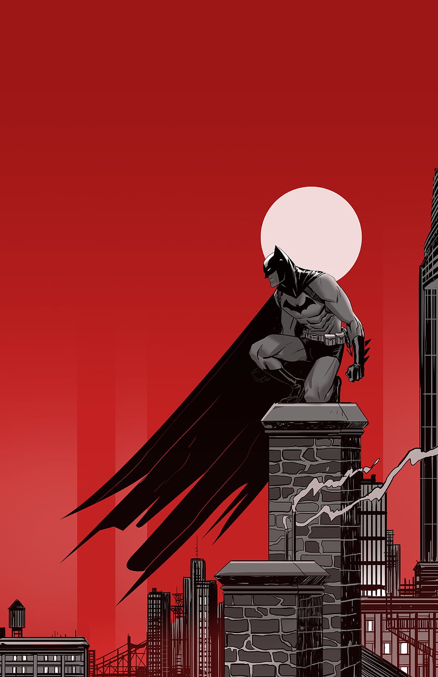 Batman crouching on Gotham rooftop against a bold red sky with a full moon HD phone wallpaper