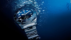 Rolex Deepsea Sea-Dweller Diver's Watch Underwater with Bubbles and Scuba Diver HD wallpaper