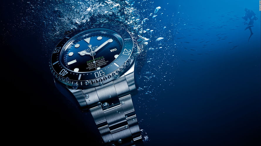 Rolex Deepsea Sea-Dweller Diver's Watch Underwater with Bubbles and Scuba Diver HD wallpaper