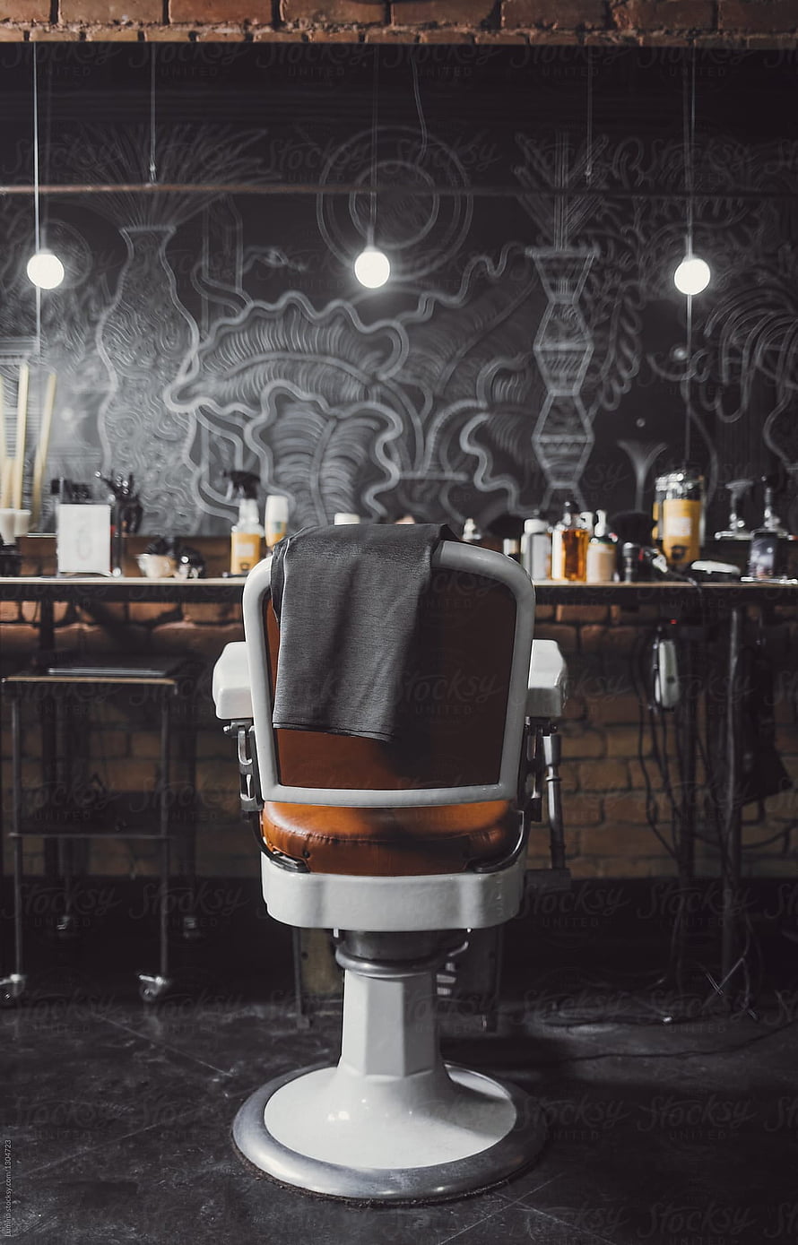 Vintage Barber Chair in Industrial Barbershop with Chalkboard Wall Art and Exposed Brick HD phone wallpaper