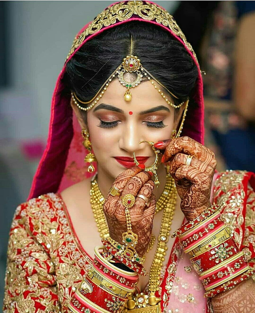 Elegant Indian Bride in Traditional Red Lehenga with Gold Jewelry and Intricate Henna HD phone wallpaper