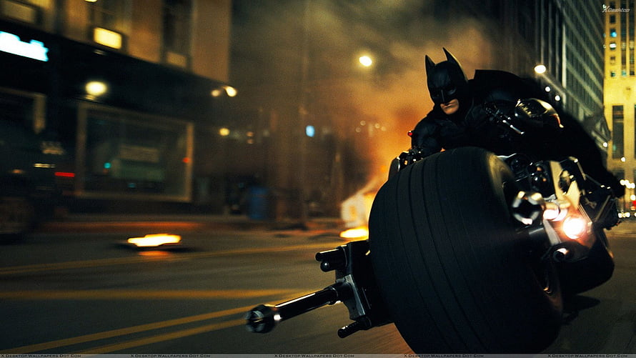 Batman on Batpod Motorcycle in Gotham City Night Chase Scene HD wallpaper