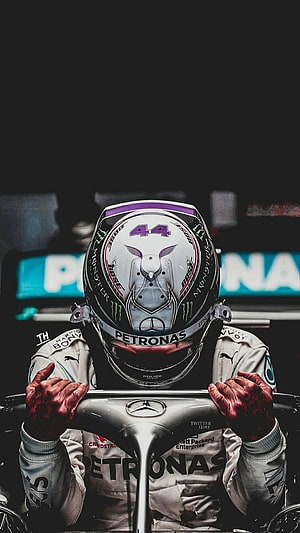 Lewis Hamilton in Mercedes Petronas Racing Suit and Helmet HD phone wallpaper