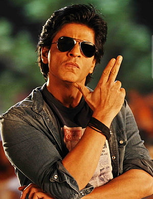 Shah Rukh Khan in Aviator Sunglasses and Denim Jacket with Finger Gesture HD phone wallpaper