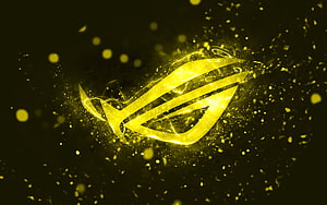 Glowing Yellow Republic of Gamers Logo with Electric Sparks and Particle Effects on Dark Background HD wallpaper