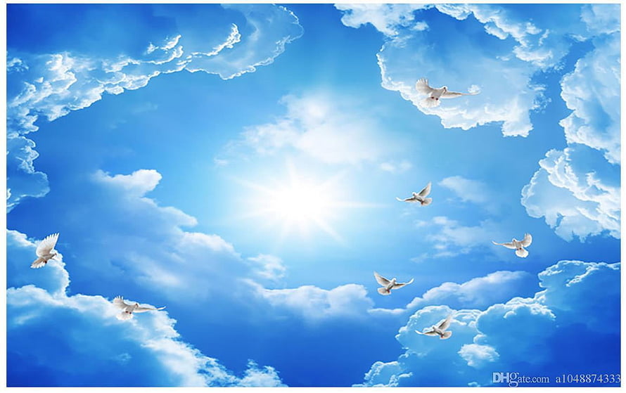 White doves soaring through a bright blue sky with fluffy clouds and radiant sunlight HD wallpaper