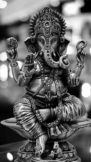 Black and White Ganesha Statue on Lotus Pedestal with Mouse Companion HD phone wallpaper