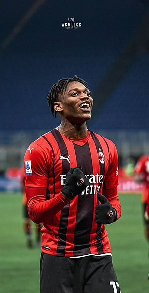Rafael Leao Celebrating in AC Milan Home Kit on the Pitch HD phone wallpaper