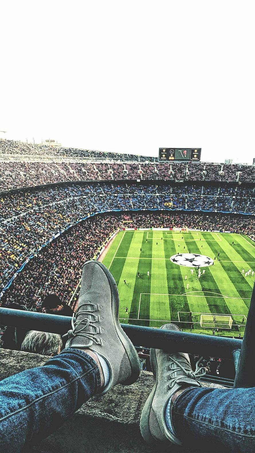 First Person View of a Football Match in a Packed Stadium with Sneakers in Foreground HD phone wallpaper