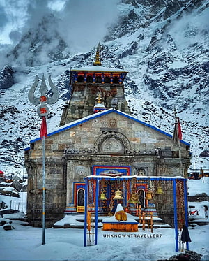 Kedarnath Temple in Snow with Prasad Bell and Trishul Against Himalayan Peaks HD phone wallpaper