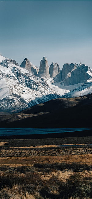 Torres Del Paine National Park in Patagonia with dramatic granite spires and alpine lake HD phone wallpaper