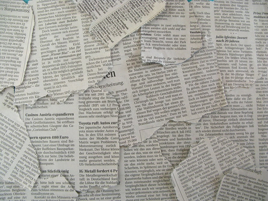 Torn Black and White Newspaper Texture Background with German Text HD wallpaper