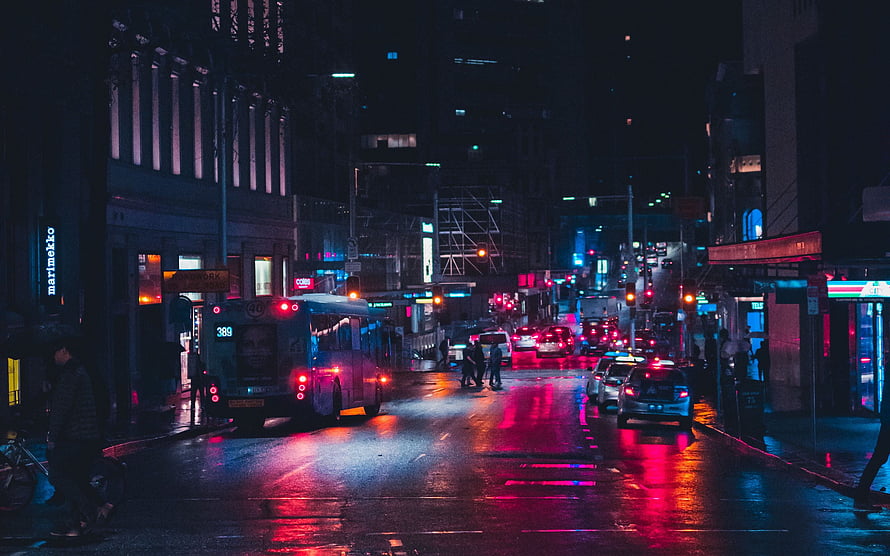 Rainy City Street at Night with Neon Traffic Lights and Wet Asphalt Reflections HD wallpaper