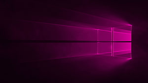 Glowing Magenta Windows 10 Logo in a Dark Minimalist Room HD wallpaper